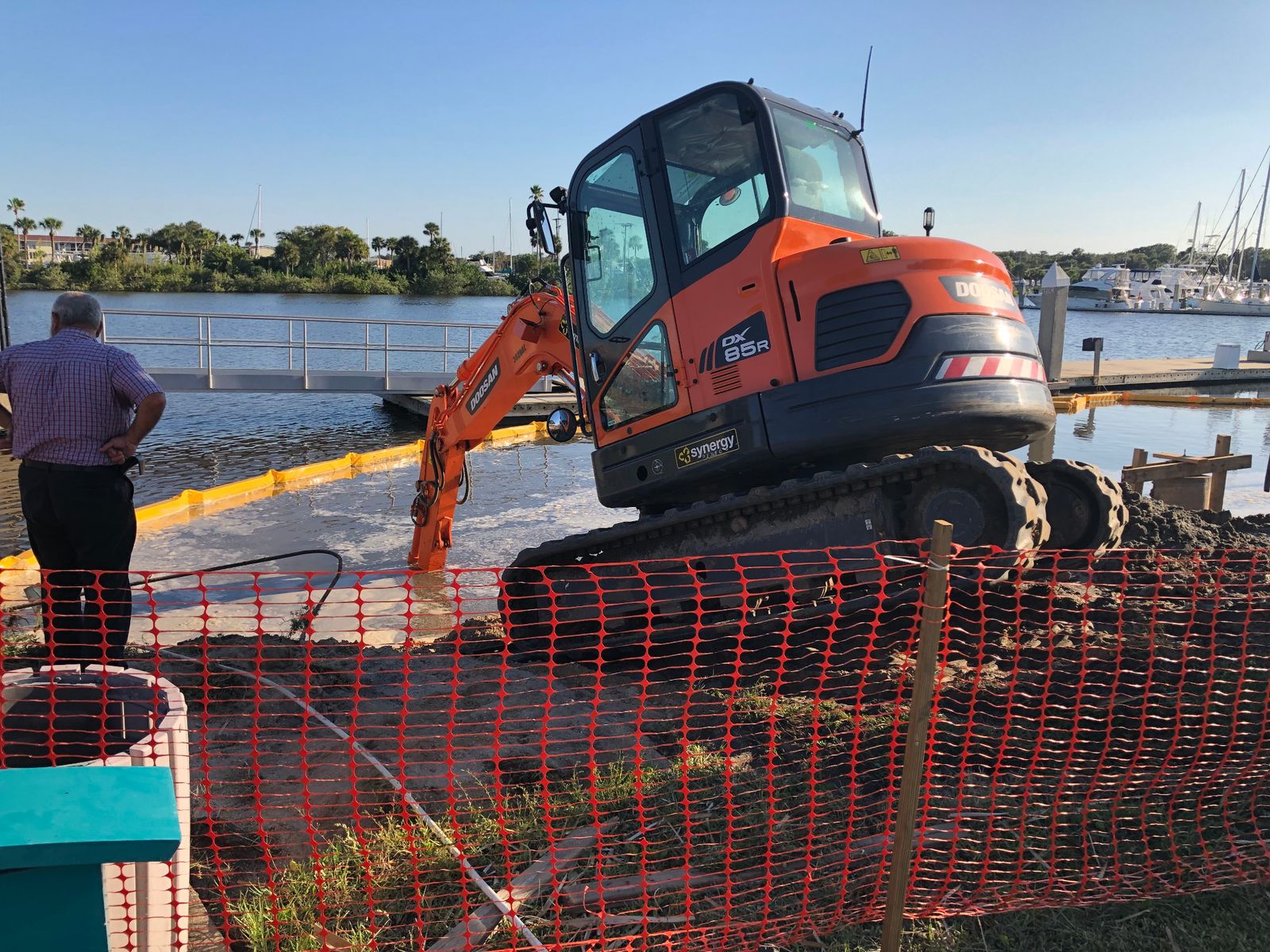 Excavator and dock work in the water