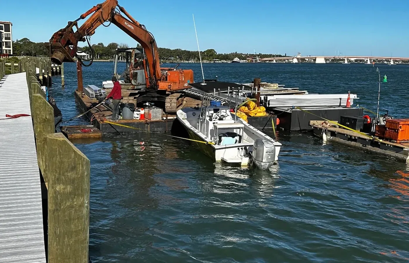 Marine construction equipment working from the water on a Florida access project by AVS Marine