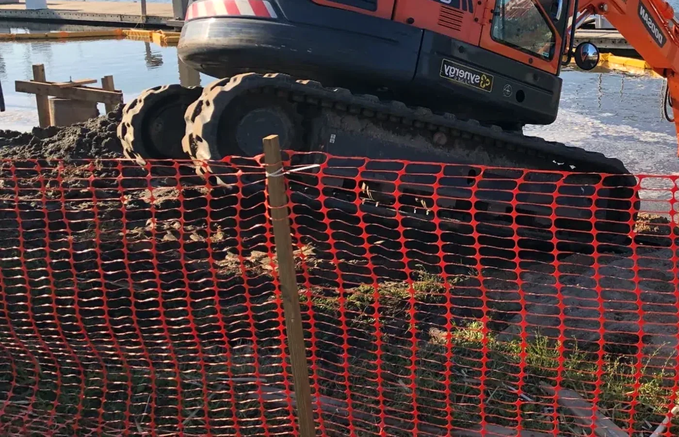 Marine excavator performing waterfront dredging and excavation work in Florida by AVS Marine